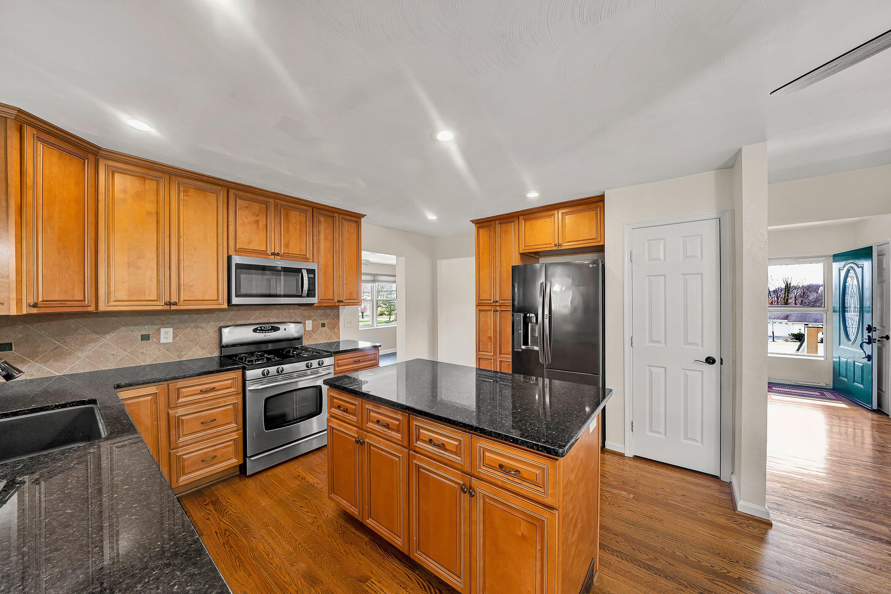 405 Diamond Road Salem, VA 24153 - Photo 8 of 28 a kitchen with stainless steel appliances granite countertop a sink a stove and refrigerator