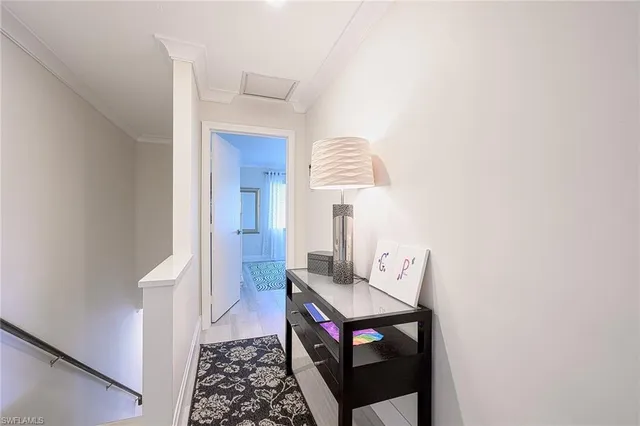 a view of hallway that has closet