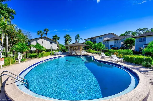 a view of a swimming pool with a patio