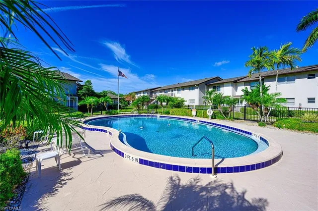 a view of a swimming pool with a patio