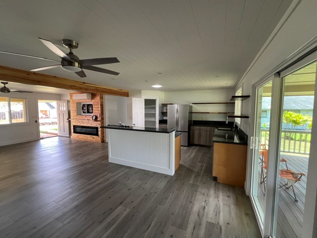 3880 Aka Road Koloa, HI 96756 - Photo 13 of 29 a view of a kitchen with microwave a stove and a refrigerator