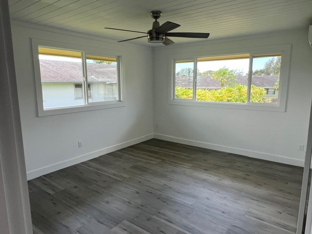 3880 Aka Road Koloa, HI 96756 - Photo 18 of 29 an empty room with wooden floor and windows