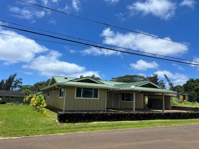 3880 Aka Road Koloa, HI 96756 - Photo 2 of 29 a front view of a house with a garden