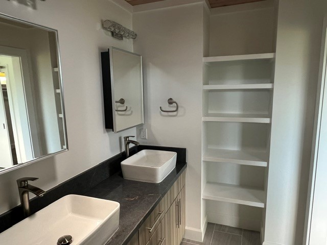 3880 Aka Road Koloa, HI 96756 - Photo 21 of 29 a bathroom with a granite countertop sink and a mirror