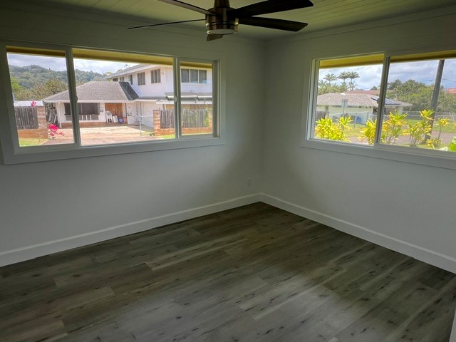 3880 Aka Road Koloa, HI 96756 - Photo 26 of 29 an empty room with wooden floor and windows