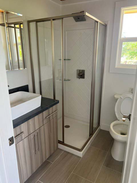3880 Aka Road Koloa, HI 96756 - Photo 29 of 29 a bathroom with a granite countertop sink toilet and shower