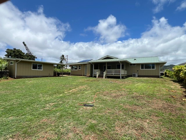 3880 Aka Road Koloa, HI 96756 - Photo 4 of 29 a front view of a house with a yard