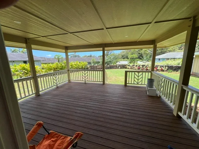 a view of a balcony with wooden floor