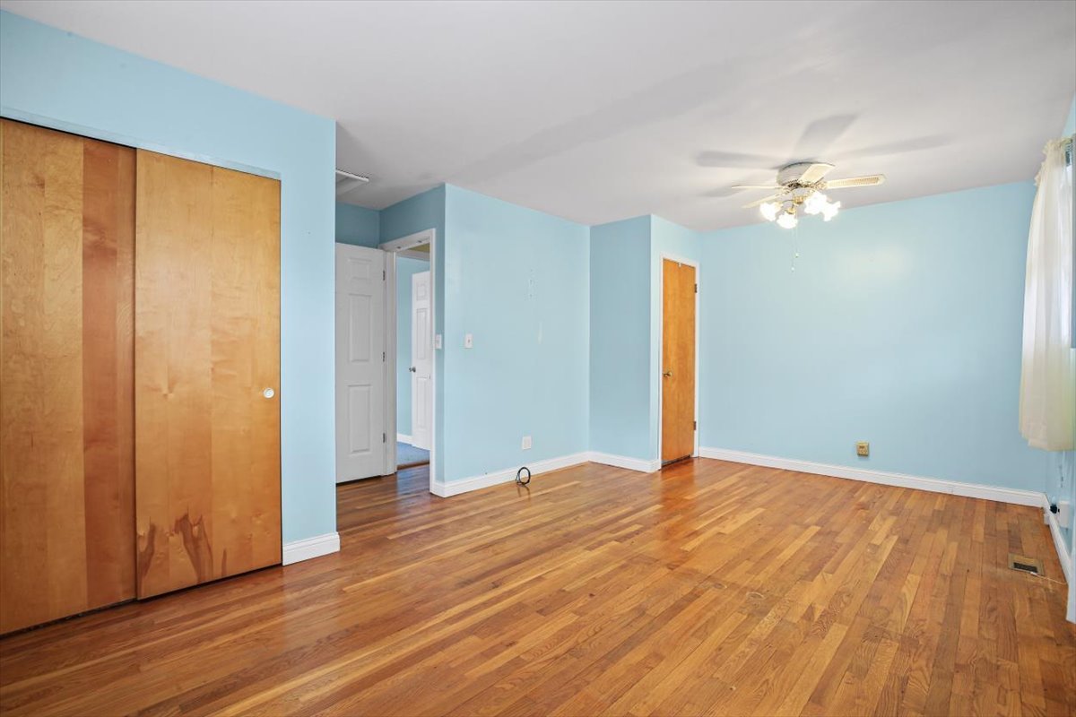 1513 Gates Drive Rantoul, IL 61866 - Photo 17 of 37 wooden floor in an empty room with a window