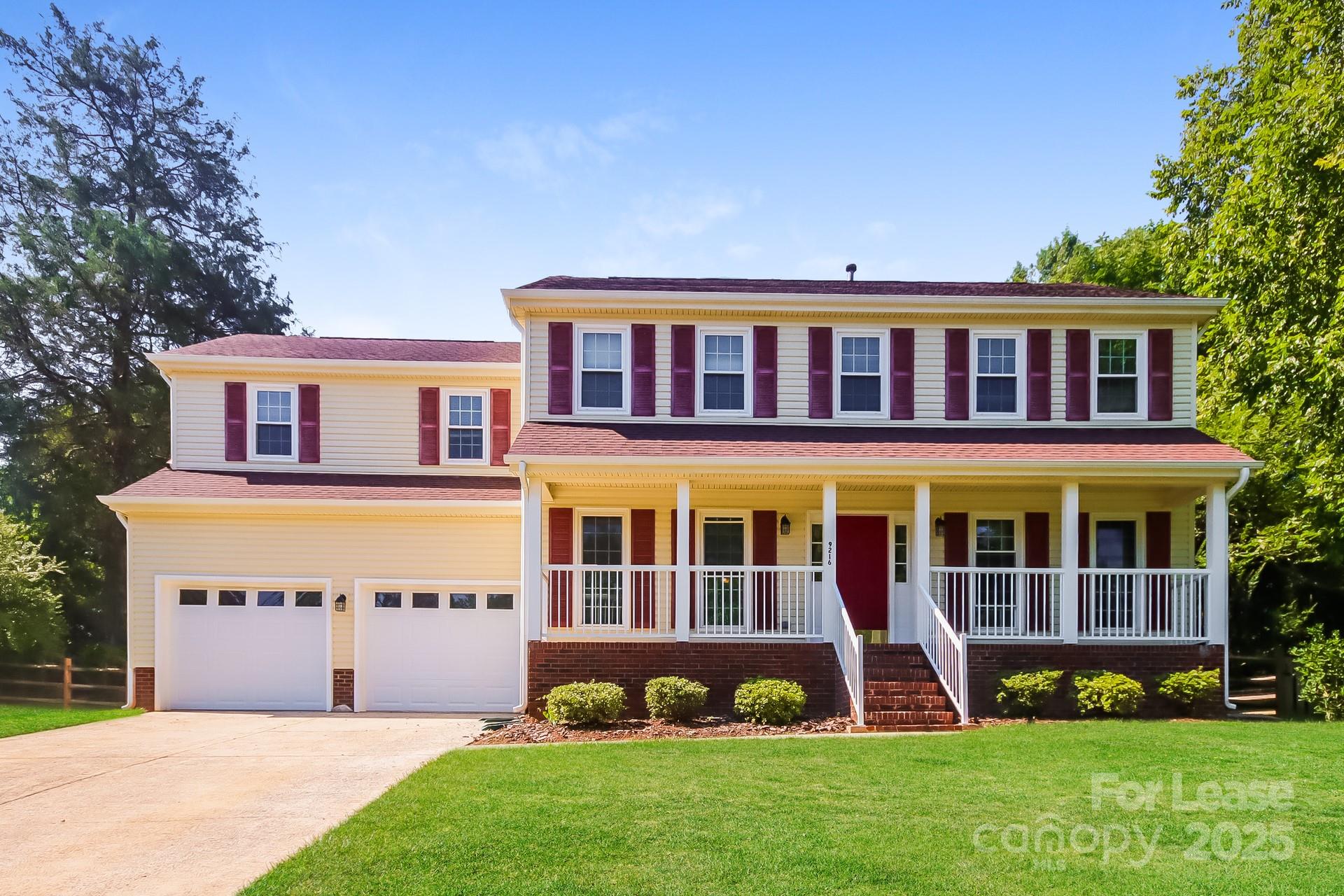 9216 Torrence Crossing Drive Huntersville, NC 28078 - Photo 1 of 17 a front view of a house with a yard