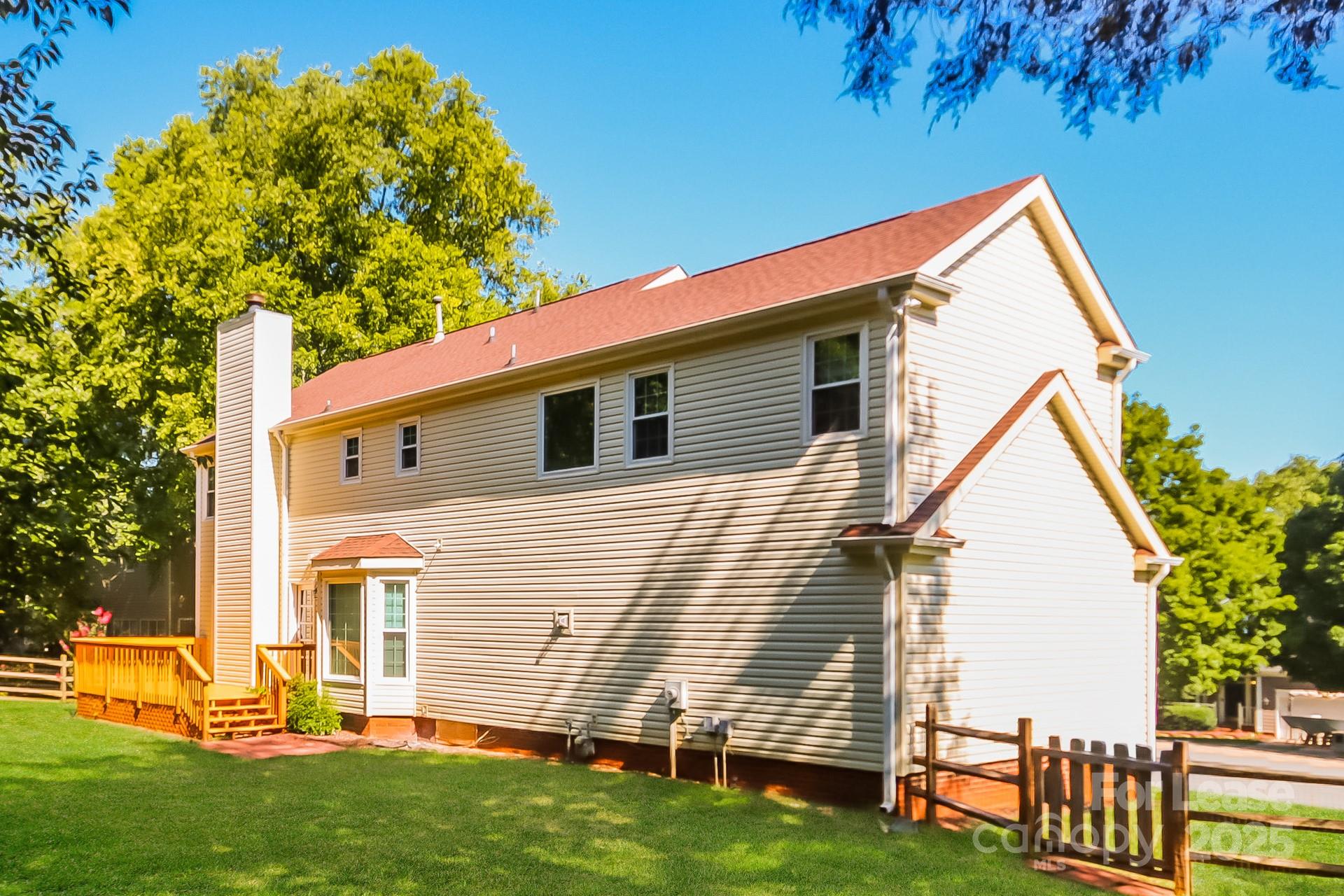 9216 Torrence Crossing Drive Huntersville, NC 28078 - Photo 14 of 17 a view of backyard with a garden and deck