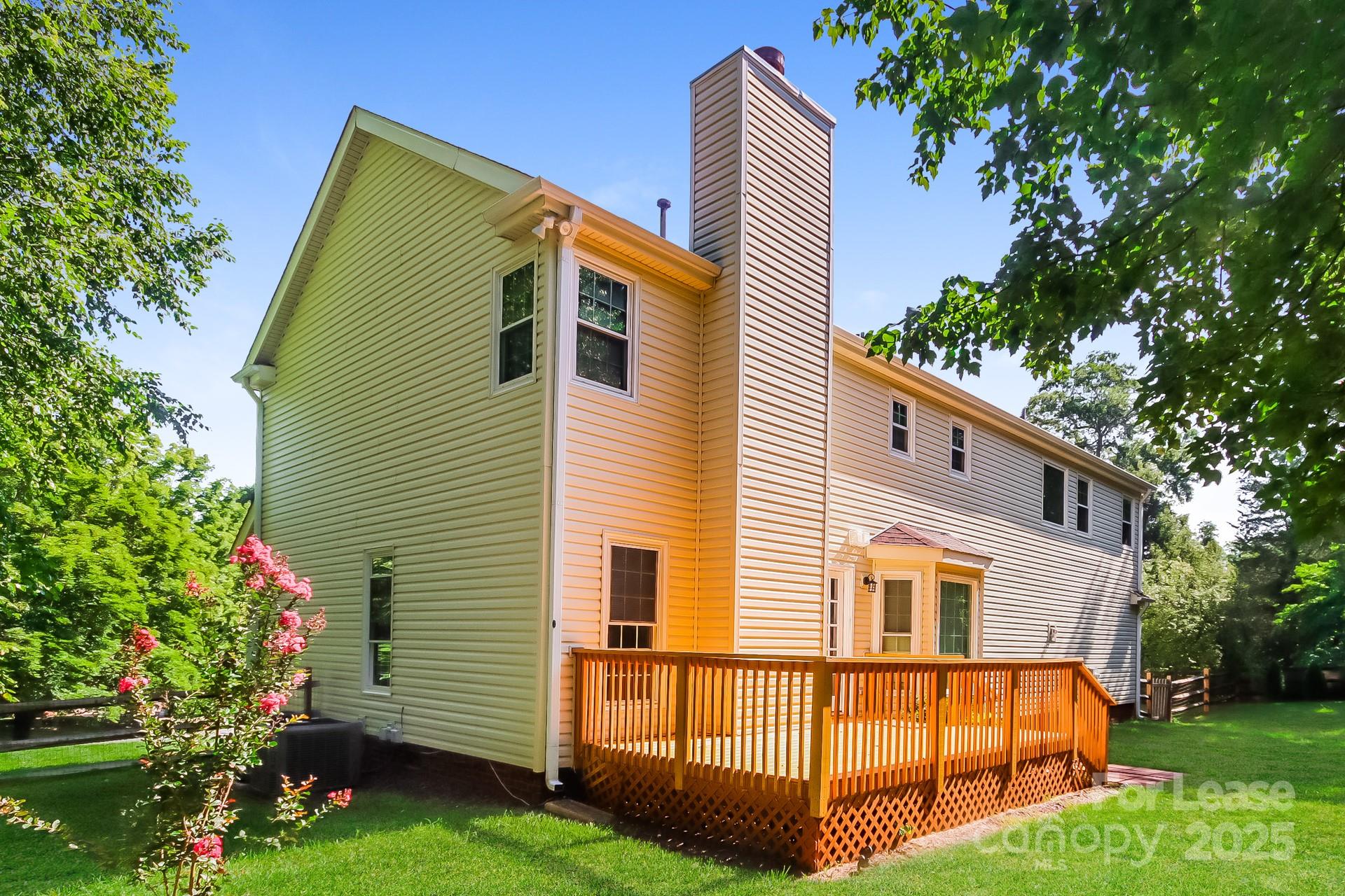 9216 Torrence Crossing Drive Huntersville, NC 28078 - Photo 15 of 17 a view of backyard with a garden and deck