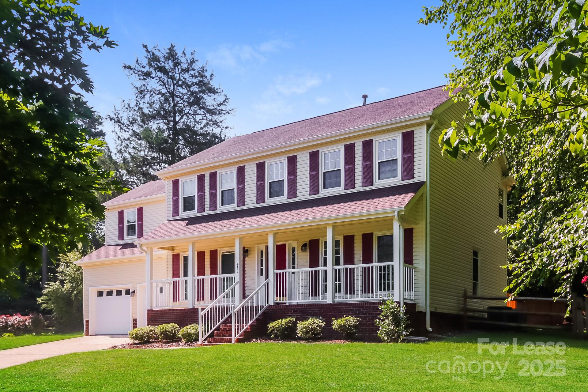 9216 Torrence Crossing Drive Huntersville, NC 28078 - Photo 2 of 17 a front view of a house with a yard