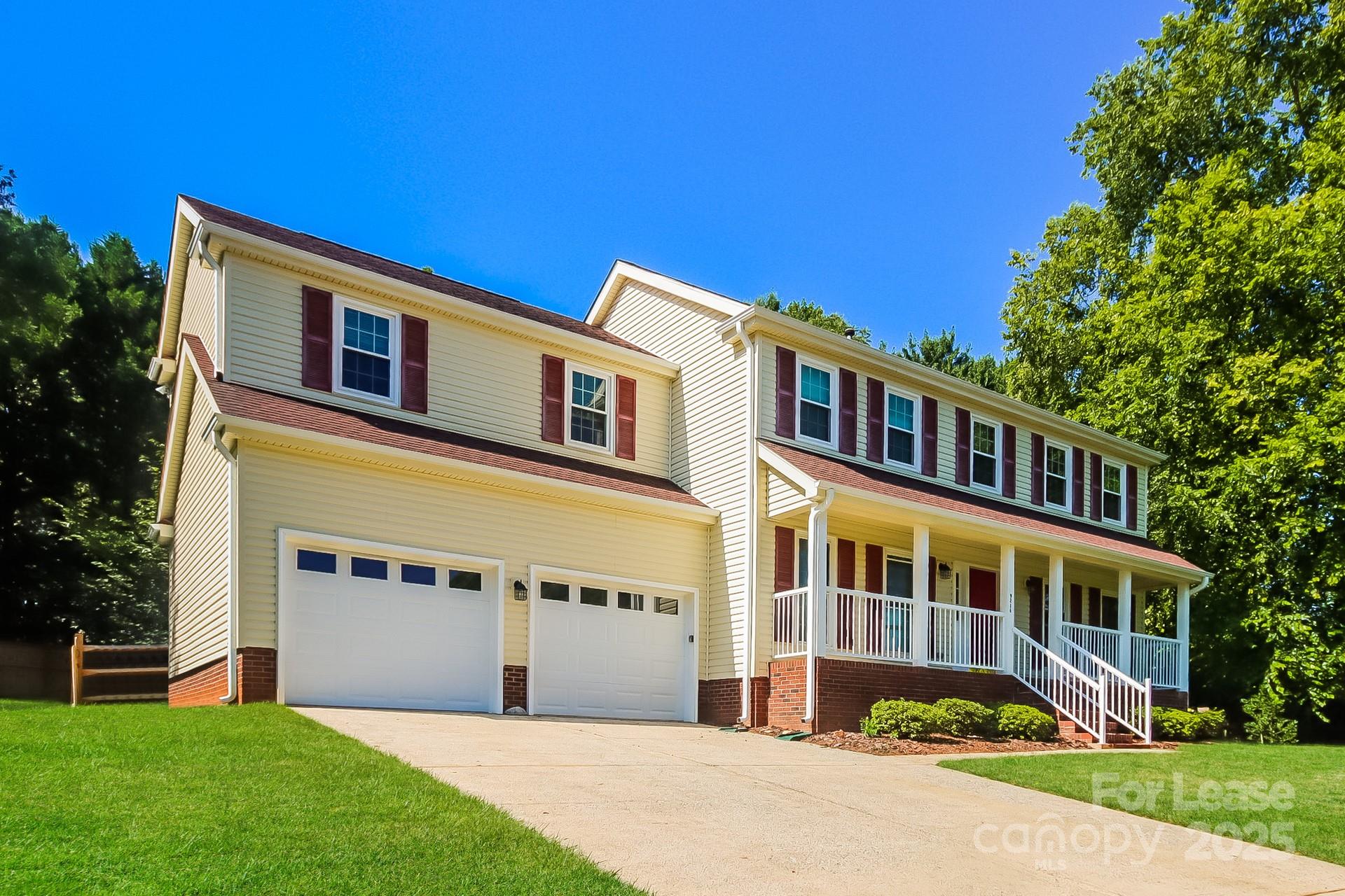 9216 Torrence Crossing Drive Huntersville, NC 28078 - Photo 3 of 17 a front view of a house with a garden