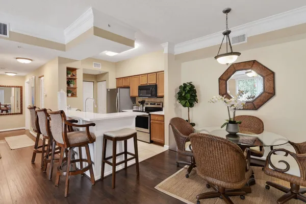 a view of a dining room with furniture window and wooden floor