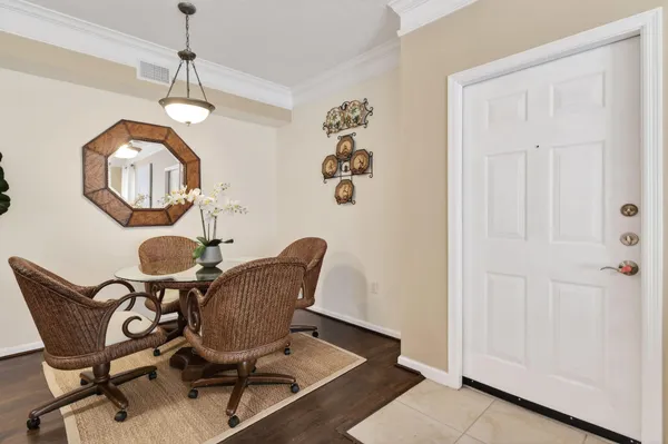 a view of a dining room with furniture and chandelier