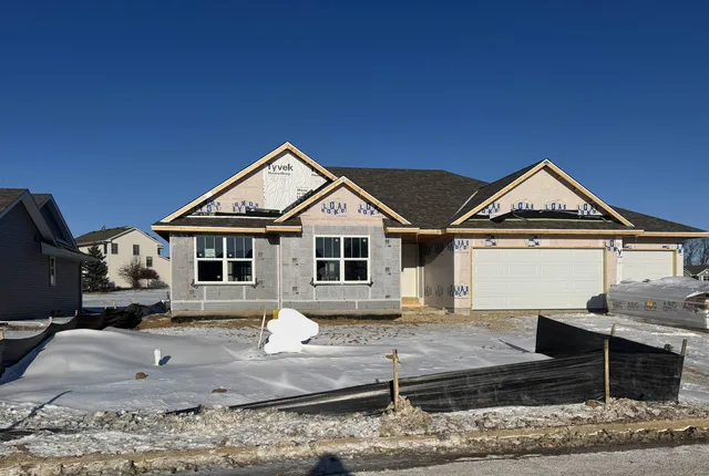 a front view of a house with yard