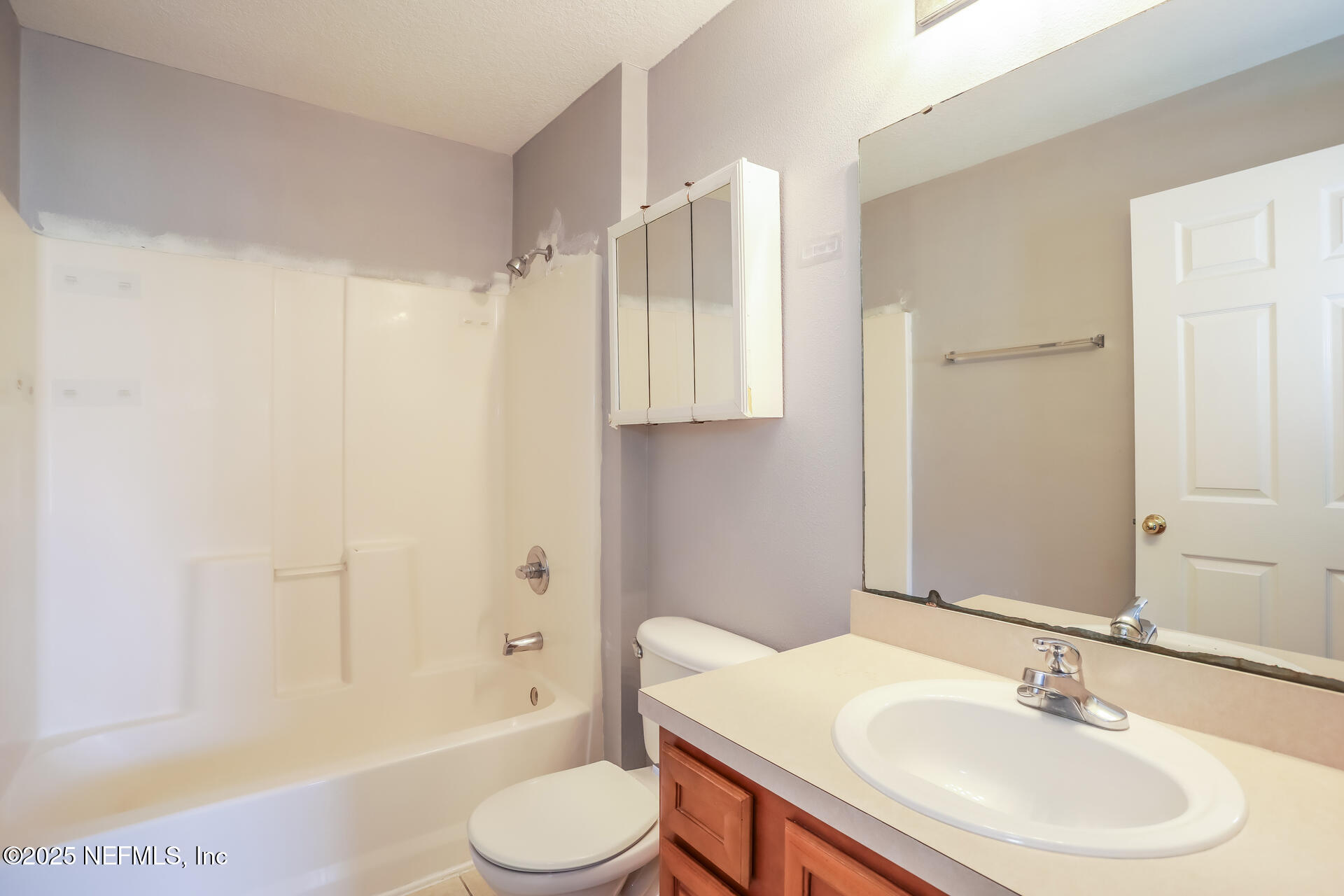 6860 Skaff Avenue, Unit 29 Jacksonville, FL 32244 - Photo 13 of 18 a bathroom with a sink toilet and shower