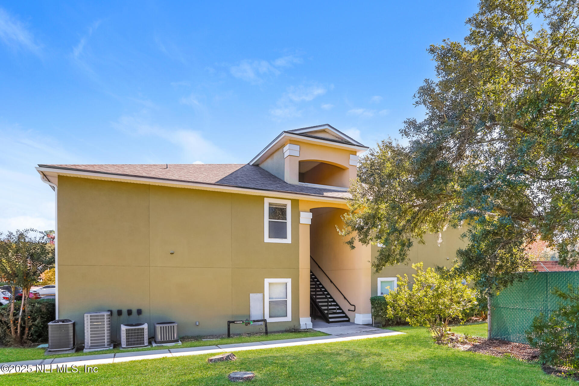 6860 Skaff Avenue, Unit 29 Jacksonville, FL 32244 - Photo 18 of 18 a front view of a house with a yard