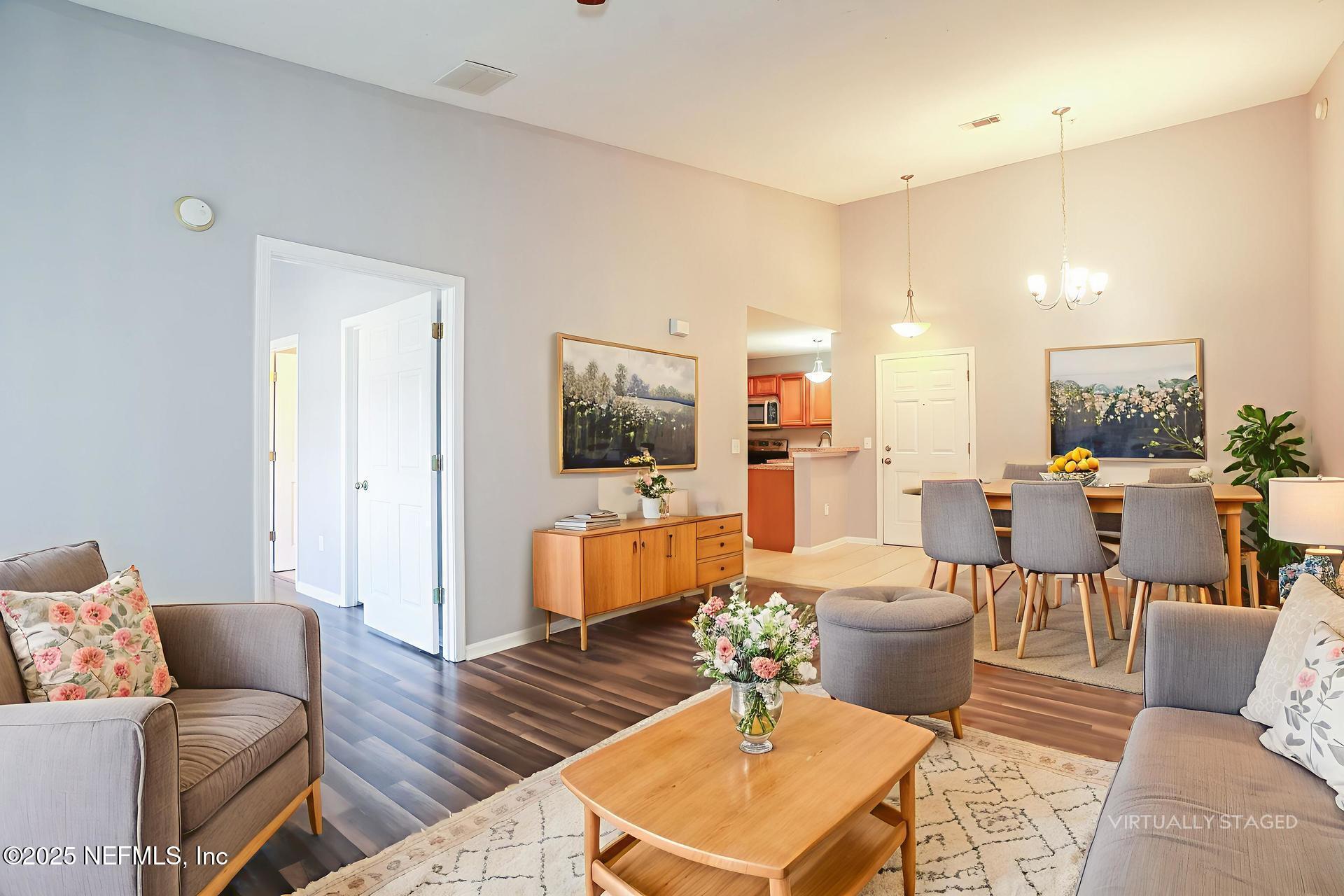 6860 Skaff Avenue, Unit 29 Jacksonville, FL 32244 - Photo 3 of 18 a living room with furniture and a large window