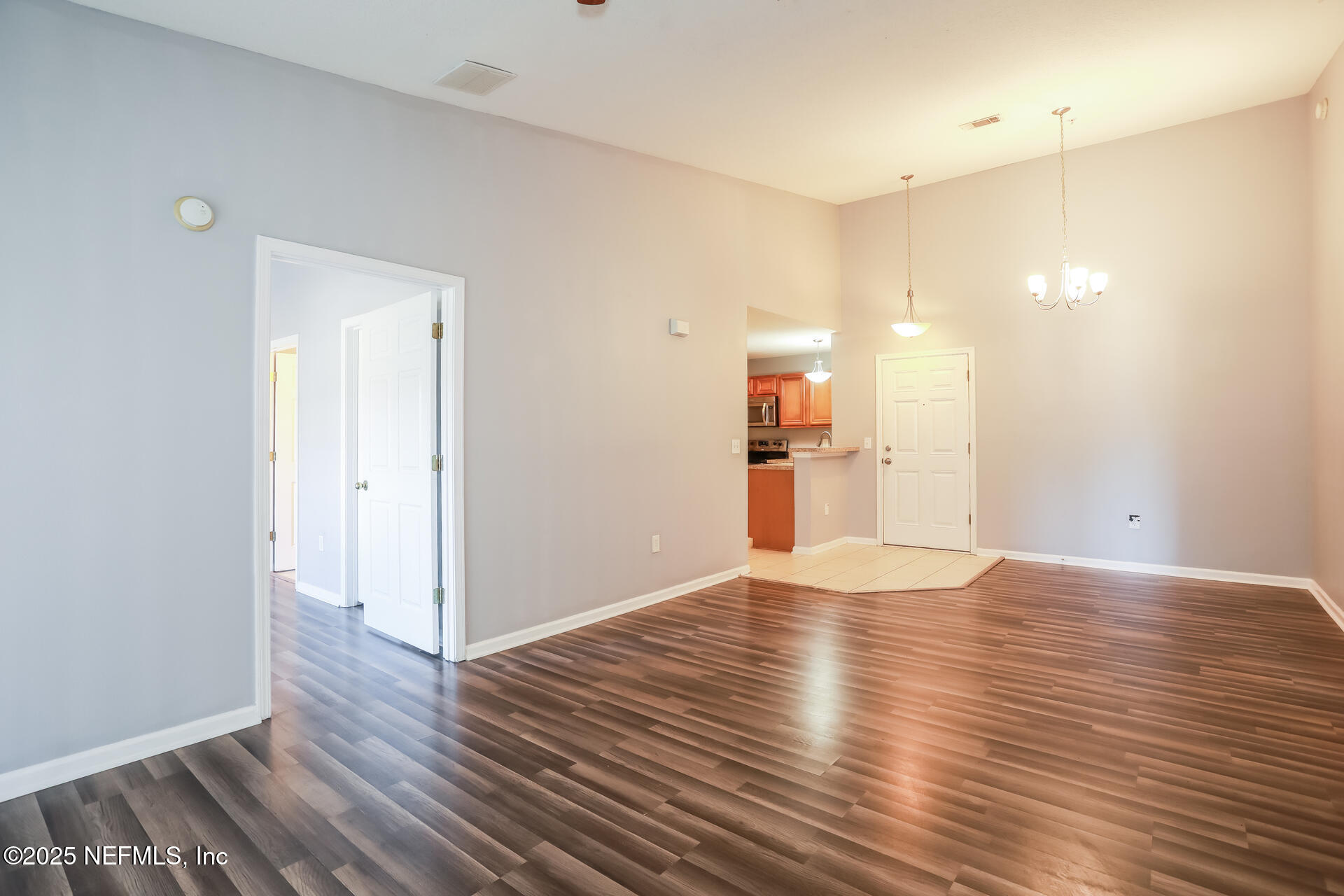 6860 Skaff Avenue, Unit 29 Jacksonville, FL 32244 - Photo 5 of 18 a view of empty room with wooden floor