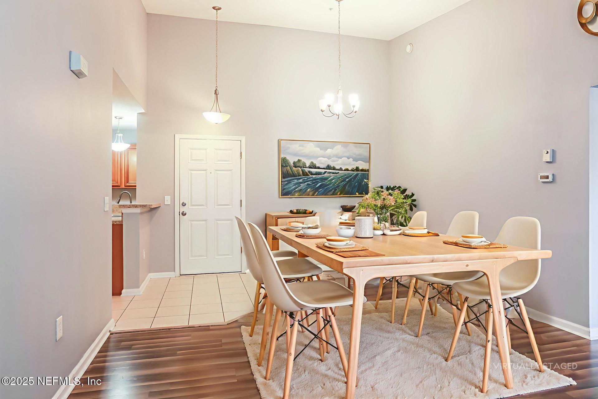 6860 Skaff Avenue, Unit 29 Jacksonville, FL 32244 - Photo 7 of 18 a view of a dining room with furniture and wooden floor