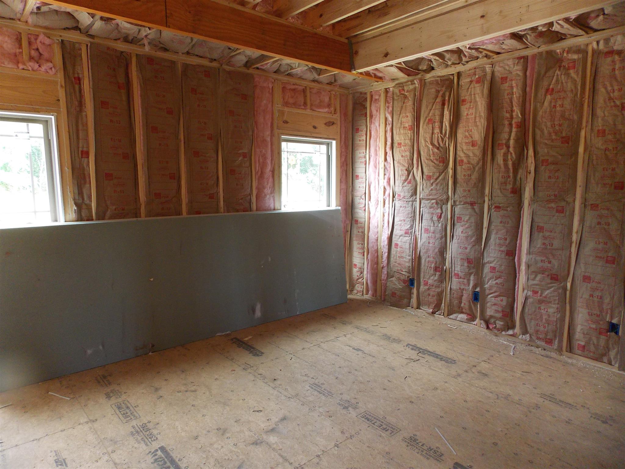 495 Ben Green Road Lebanon, TN 37090 - Photo 5 of 16 a view of an empty room with wooden walls and a window