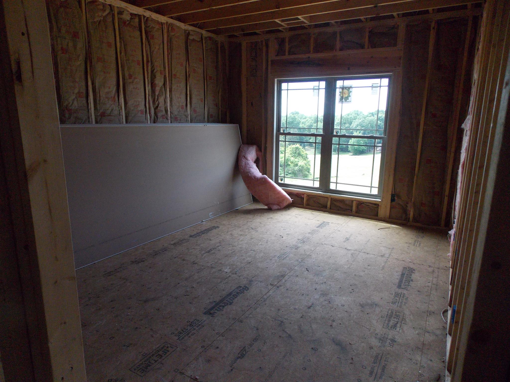 495 Ben Green Road Lebanon, TN 37090 - Photo 8 of 16 a room with a window and a ceiling fan