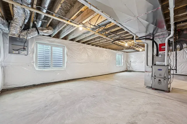 a living room with furniture floor to ceiling window and wooden floor