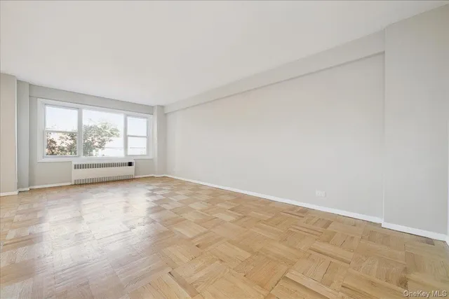 a kitchen with a stove and a white cabinet