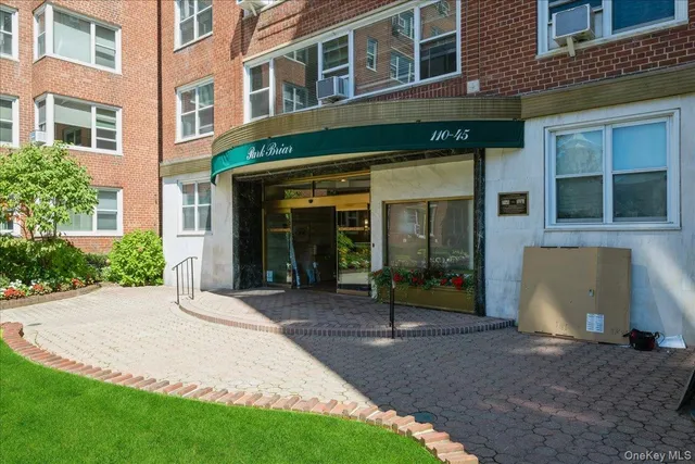 a view of a building with a yard