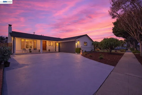 a view of house with yard and street view