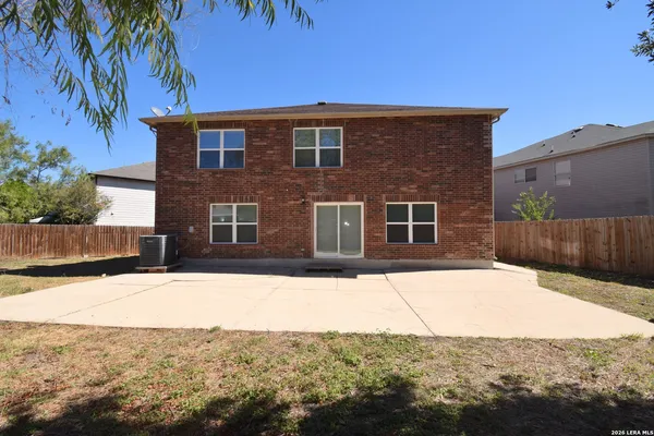 a view of a building with snow on the road