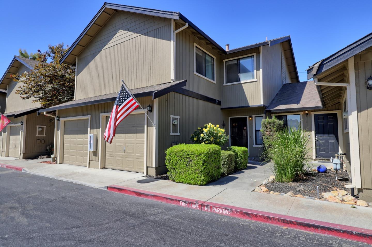 a front view of a house with garden