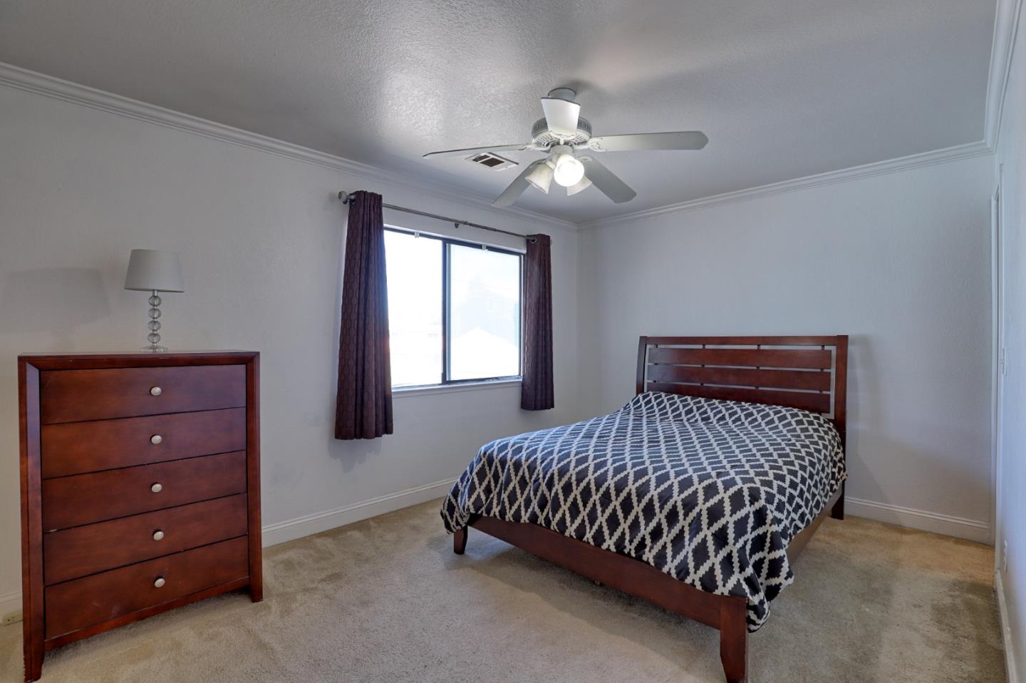 801 Nash Road, Unit I2 Hollister, CA 95023 - Photo 12 of 26 a bedroom with a bed and window