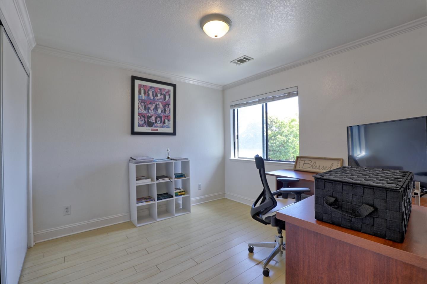 801 Nash Road, Unit I2 Hollister, CA 95023 - Photo 15 of 26 a view of a workspace with furniture and a window