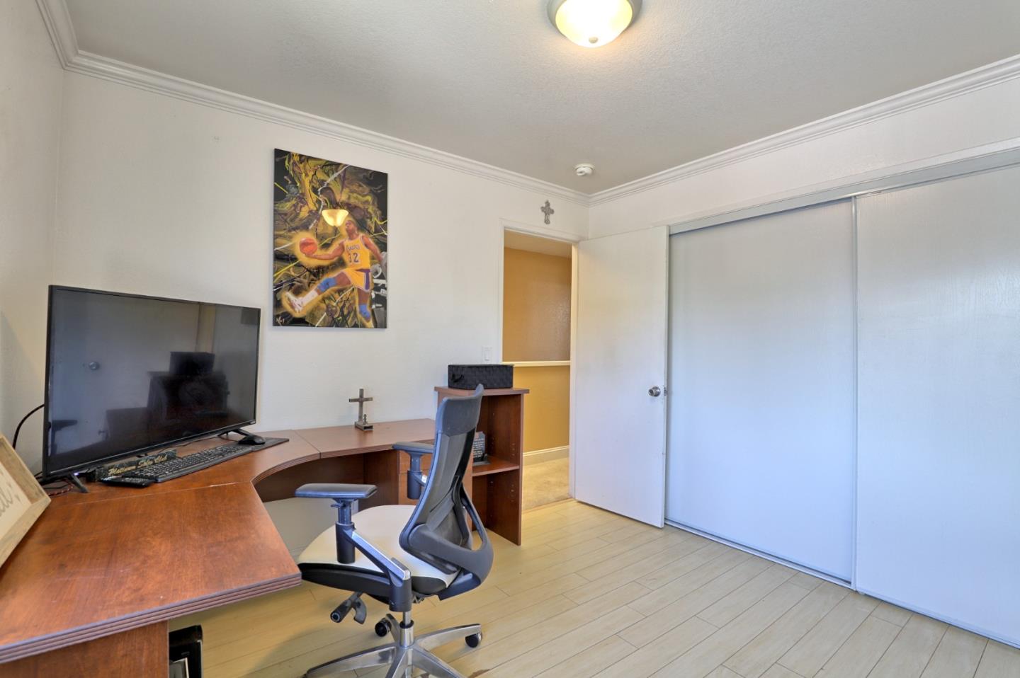 801 Nash Road, Unit I2 Hollister, CA 95023 - Photo 16 of 26 a view of a workspace with furniture and a flat screen tv