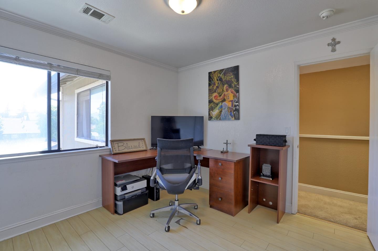 801 Nash Road, Unit I2 Hollister, CA 95023 - Photo 17 of 26 a view of a workspace with furniture and a window
