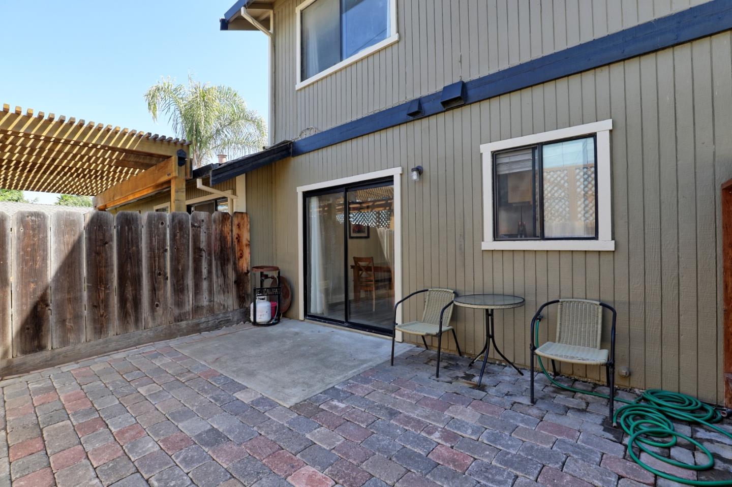 801 Nash Road, Unit I2 Hollister, CA 95023 - Photo 21 of 26 a view of a chairs and bench in the porch