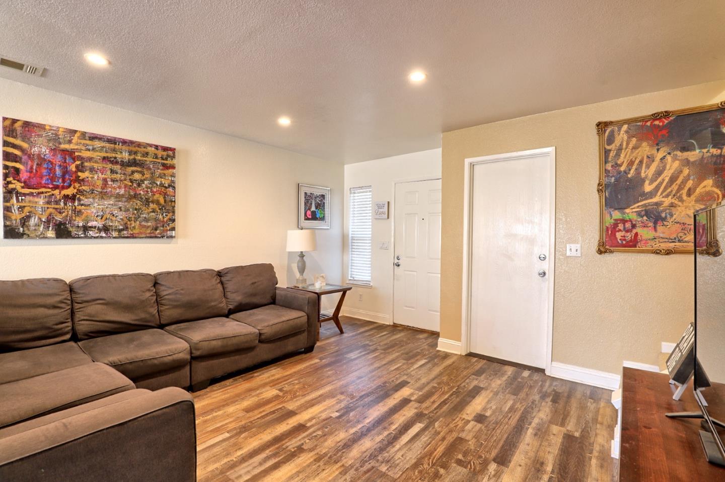 801 Nash Road, Unit I2 Hollister, CA 95023 - Photo 4 of 26 a living room with furniture and a wooden floor