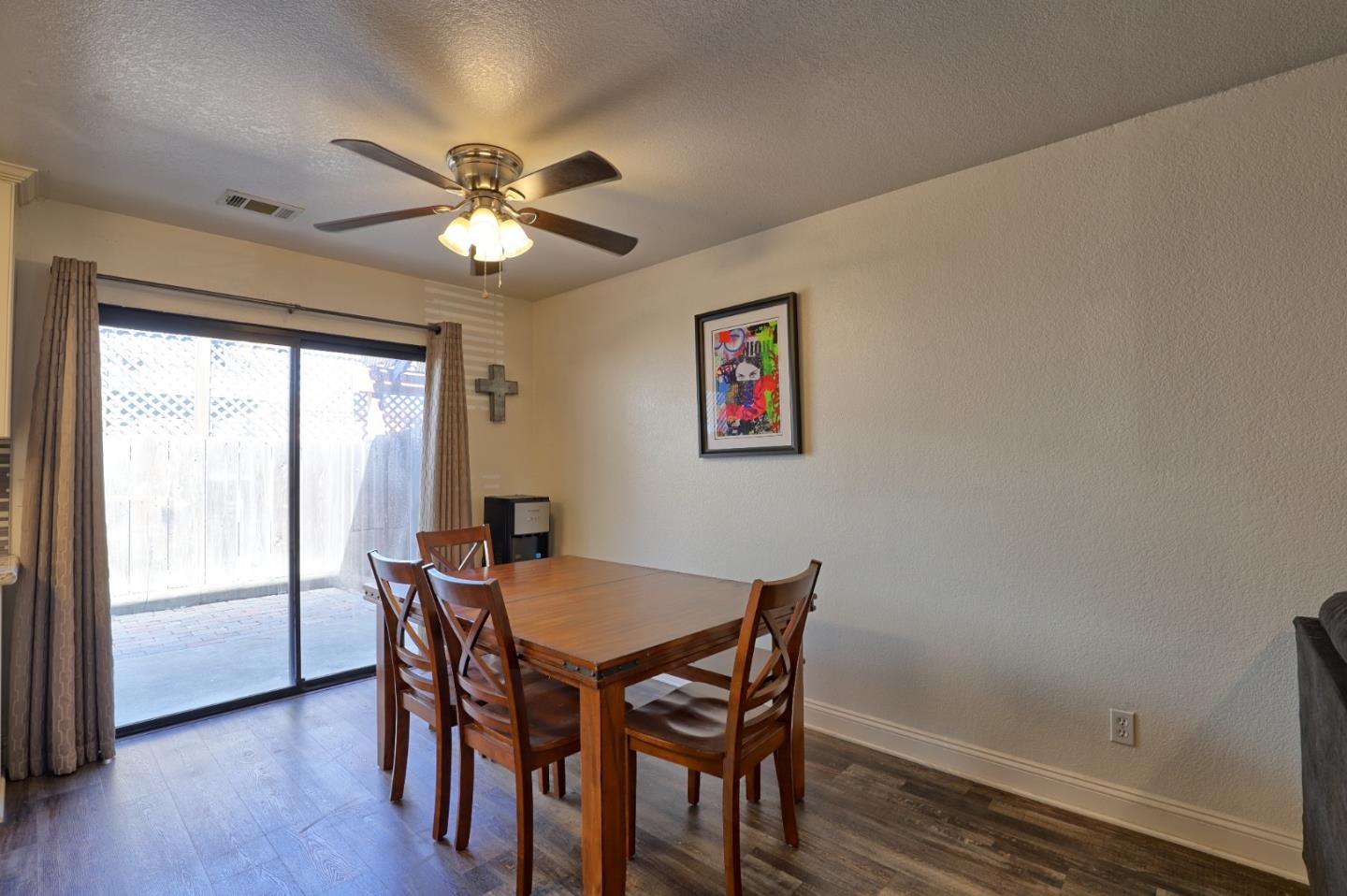 801 Nash Road, Unit I2 Hollister, CA 95023 - Photo 5 of 26 a dining room with furniture and window