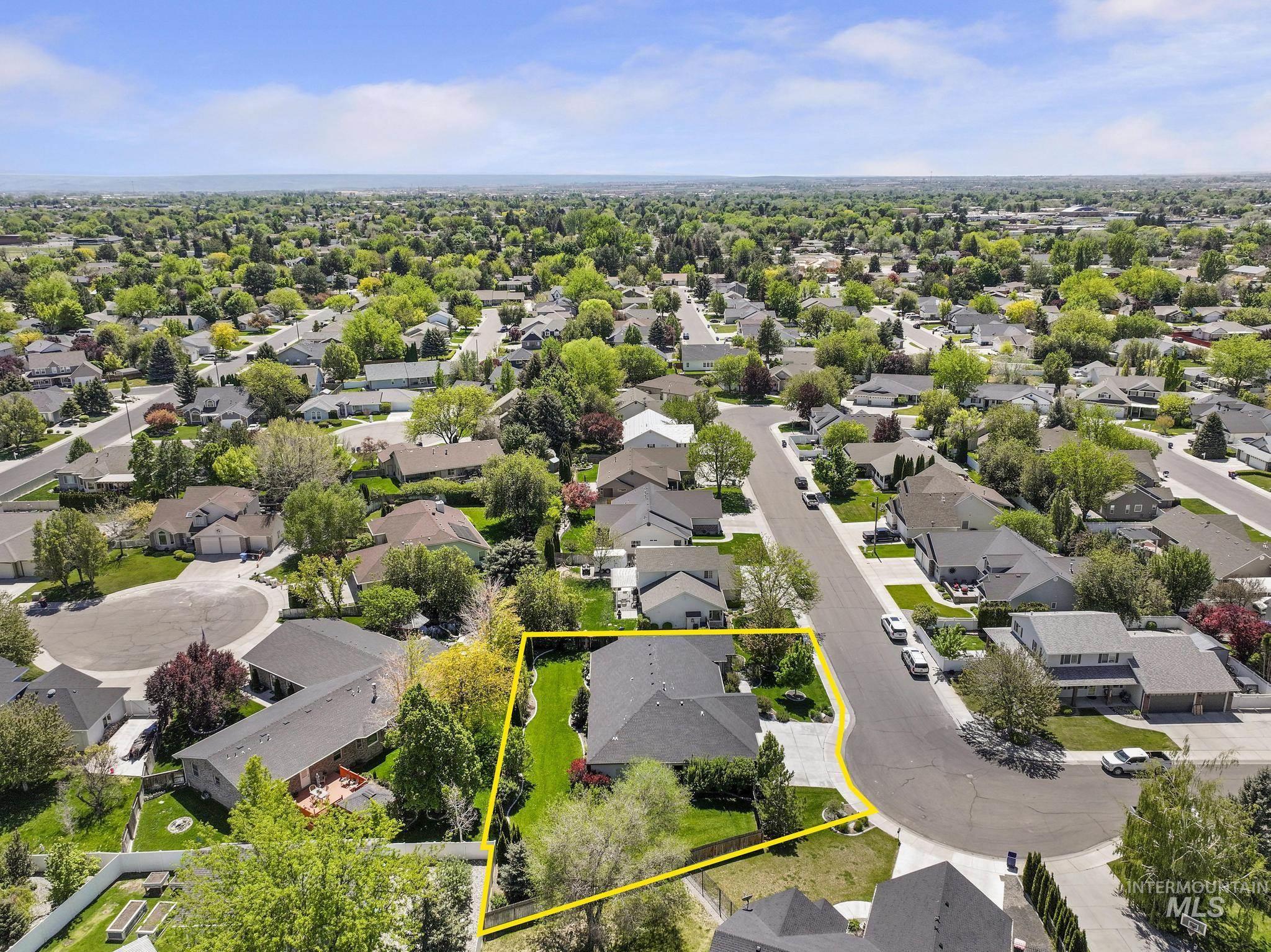 1937 Tamarack Loop Twin Falls, ID 83301 - Photo 48 of 50 Aerial perspective showcasing a residential property with a dark shingle roof and a paved driveway