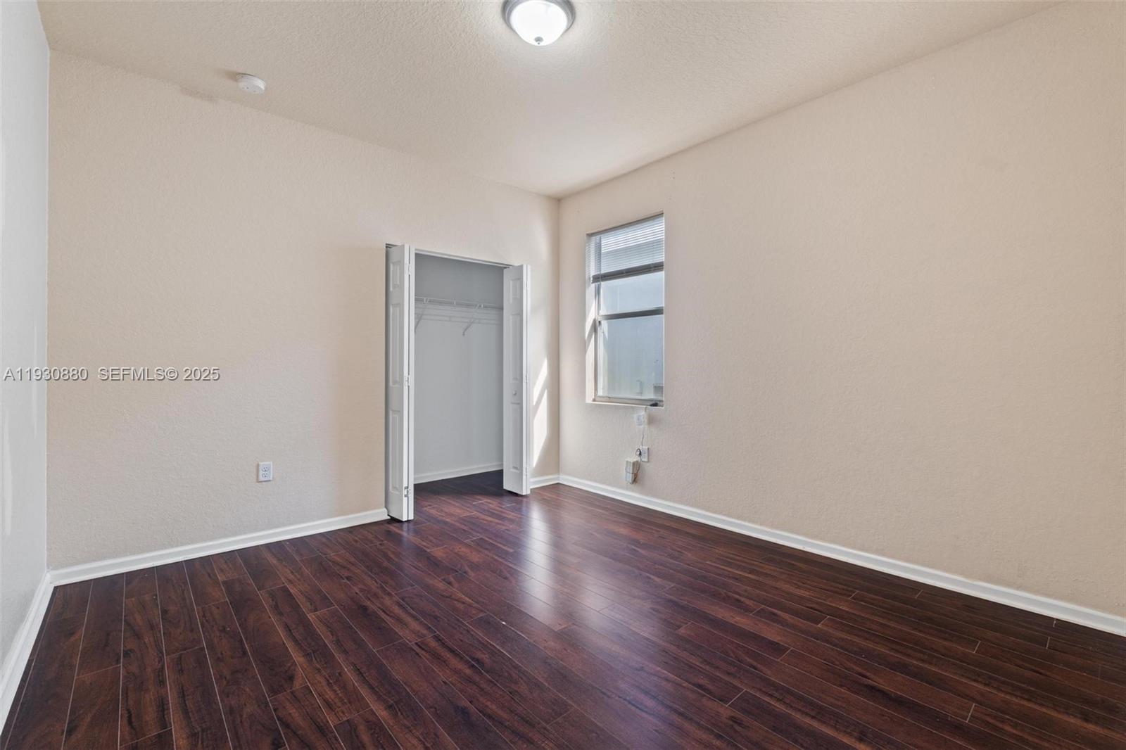3448 Northeast 1st Street, Unit 3448 Homestead, FL 33033 - Photo 15 of 19 a view of an empty room with wooden floor