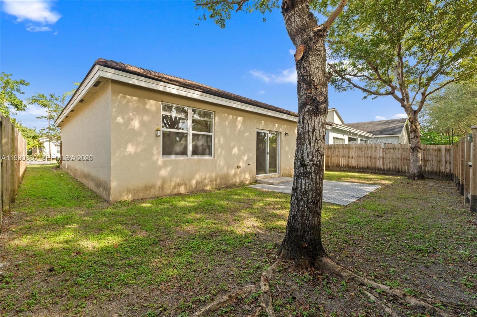 3448 Northeast 1st Street, Unit 3448 Homestead, FL 33033 - Photo 18 of 19 a view of a house with backyard