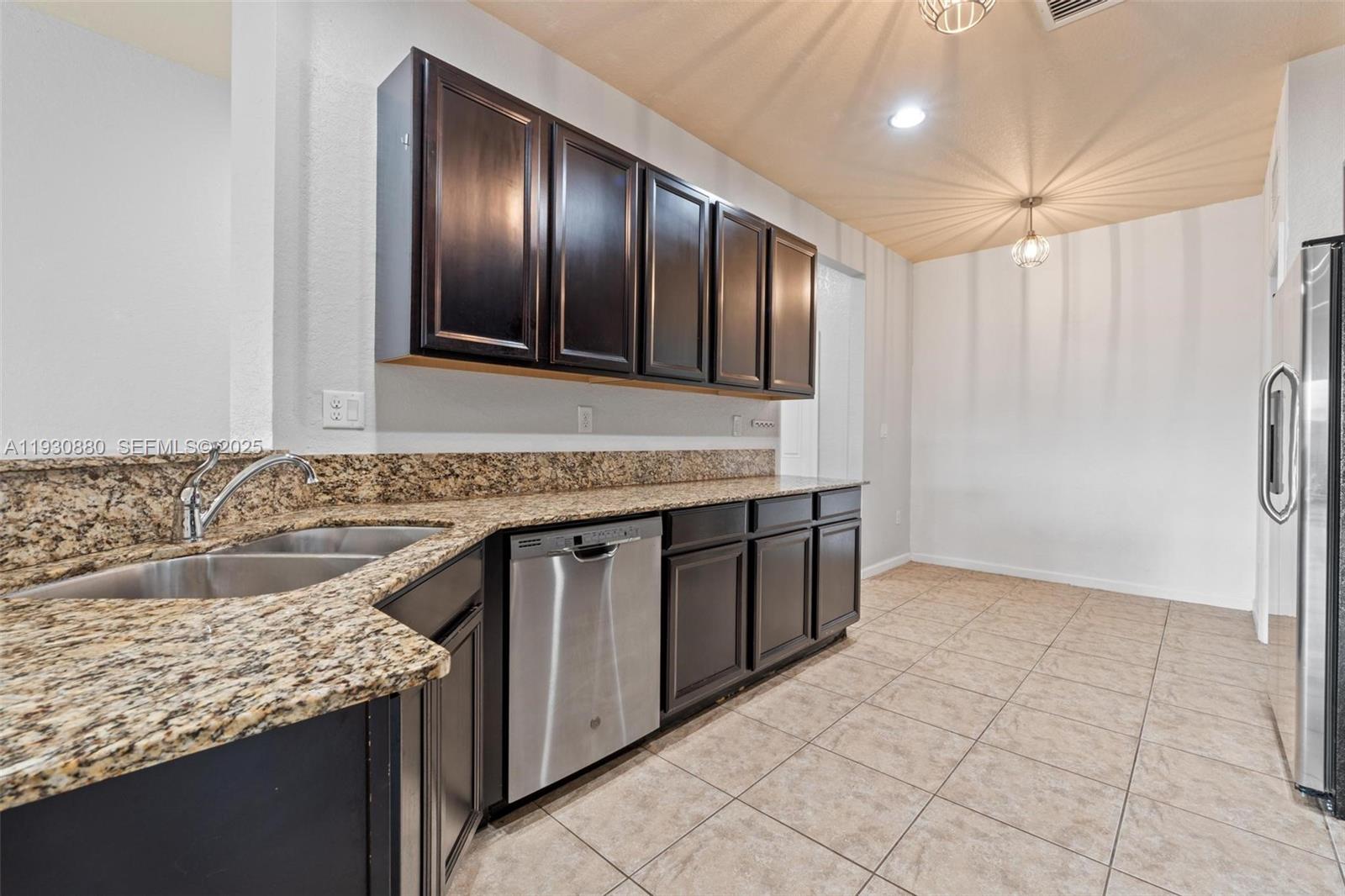 3448 Northeast 1st Street, Unit 3448 Homestead, FL 33033 - Photo 6 of 19 a spacious bathroom with a granite countertop sink and a mirror