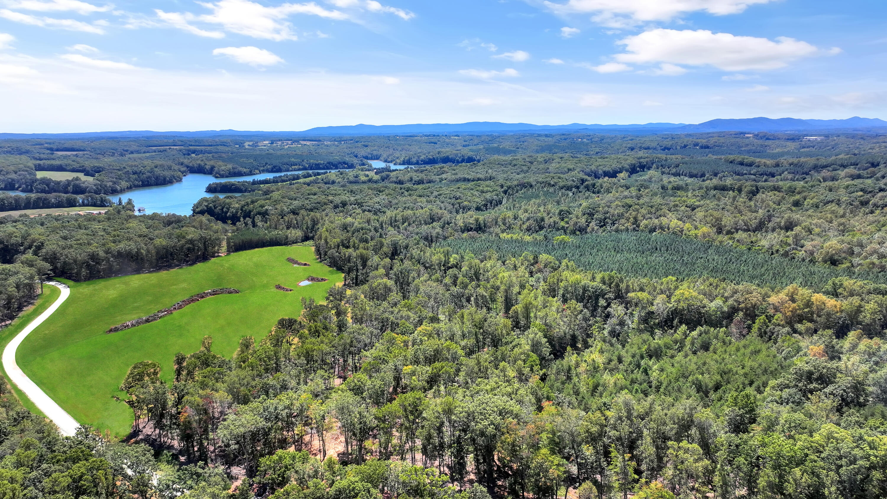 Lot 32 Hidden Treasures Lane Union Hall, VA 24176 - Photo 2 of 11 a view of a city with lush green forest