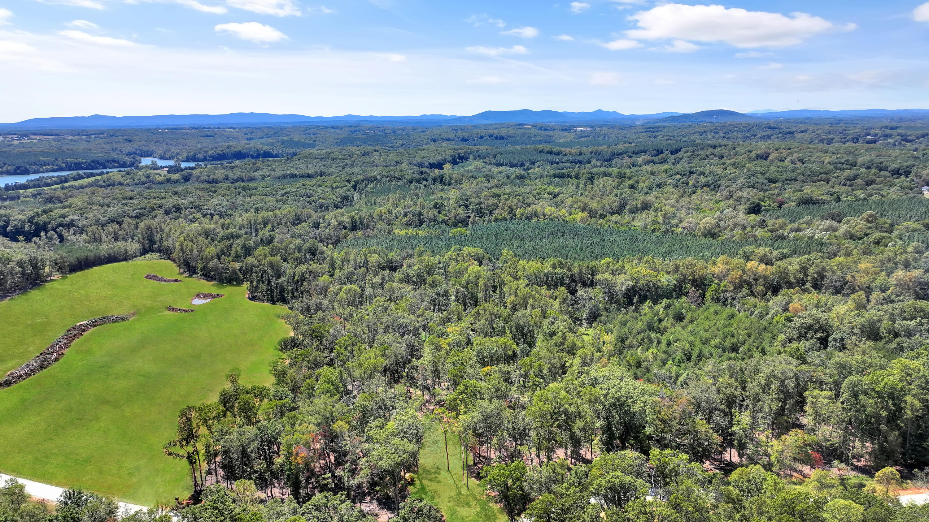 Lot 32 Hidden Treasures Lane Union Hall, VA 24176 - Photo 3 of 11 a view of a lush green hillside and a houses
