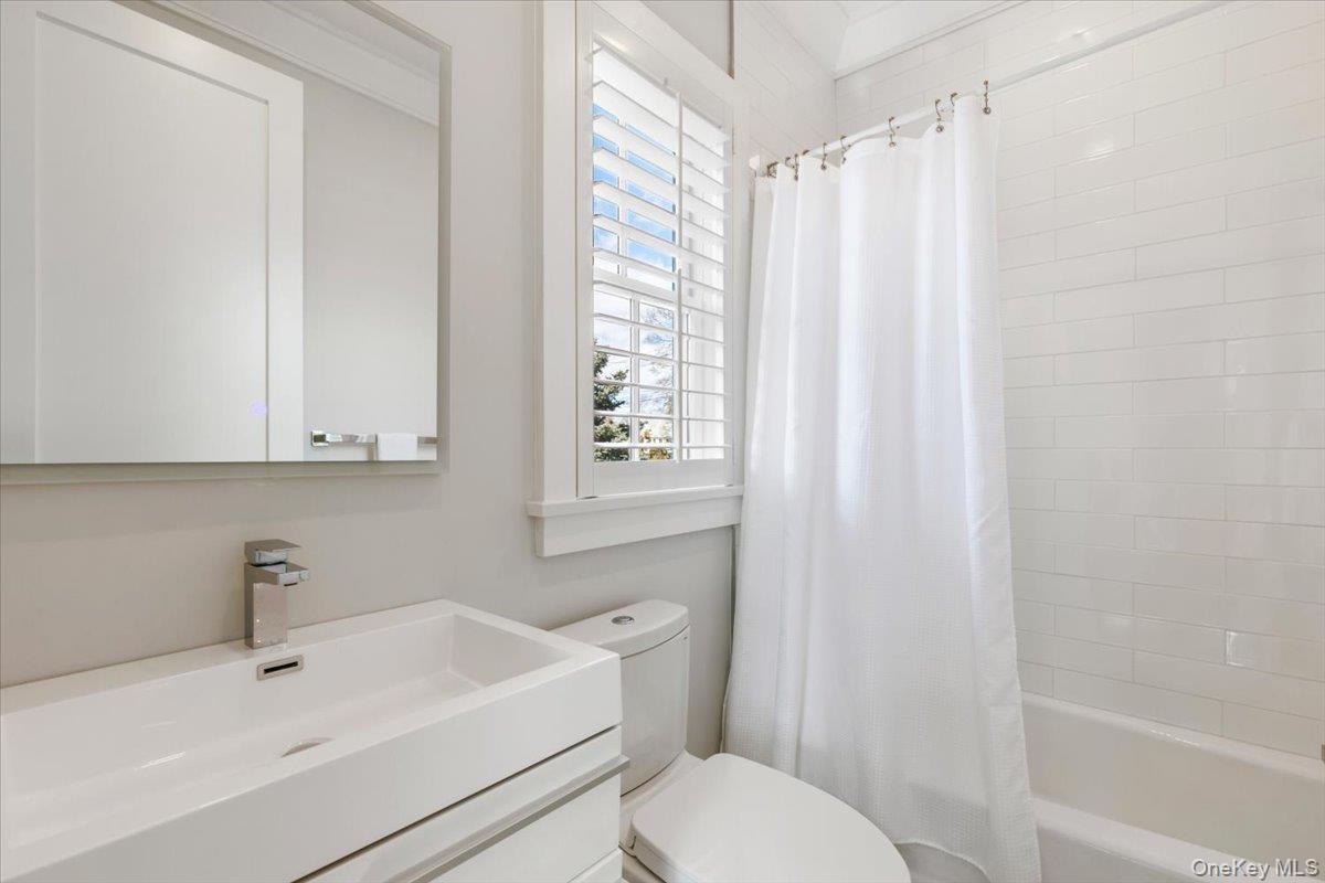 100 Dearborn Avenue Rye, NY 10580 - Photo 23 of 49 a bathroom with a sink a toilet and shower