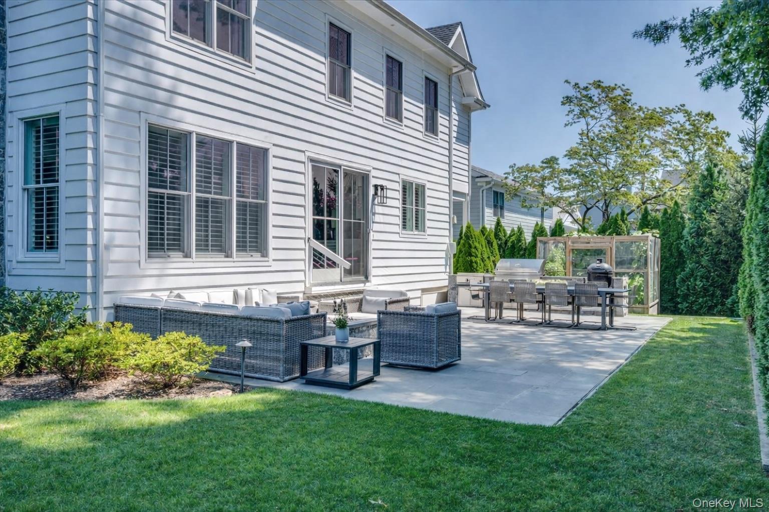 100 Dearborn Avenue Rye, NY 10580 - Photo 37 of 49 a view of backyard of house with outdoor seating and green space