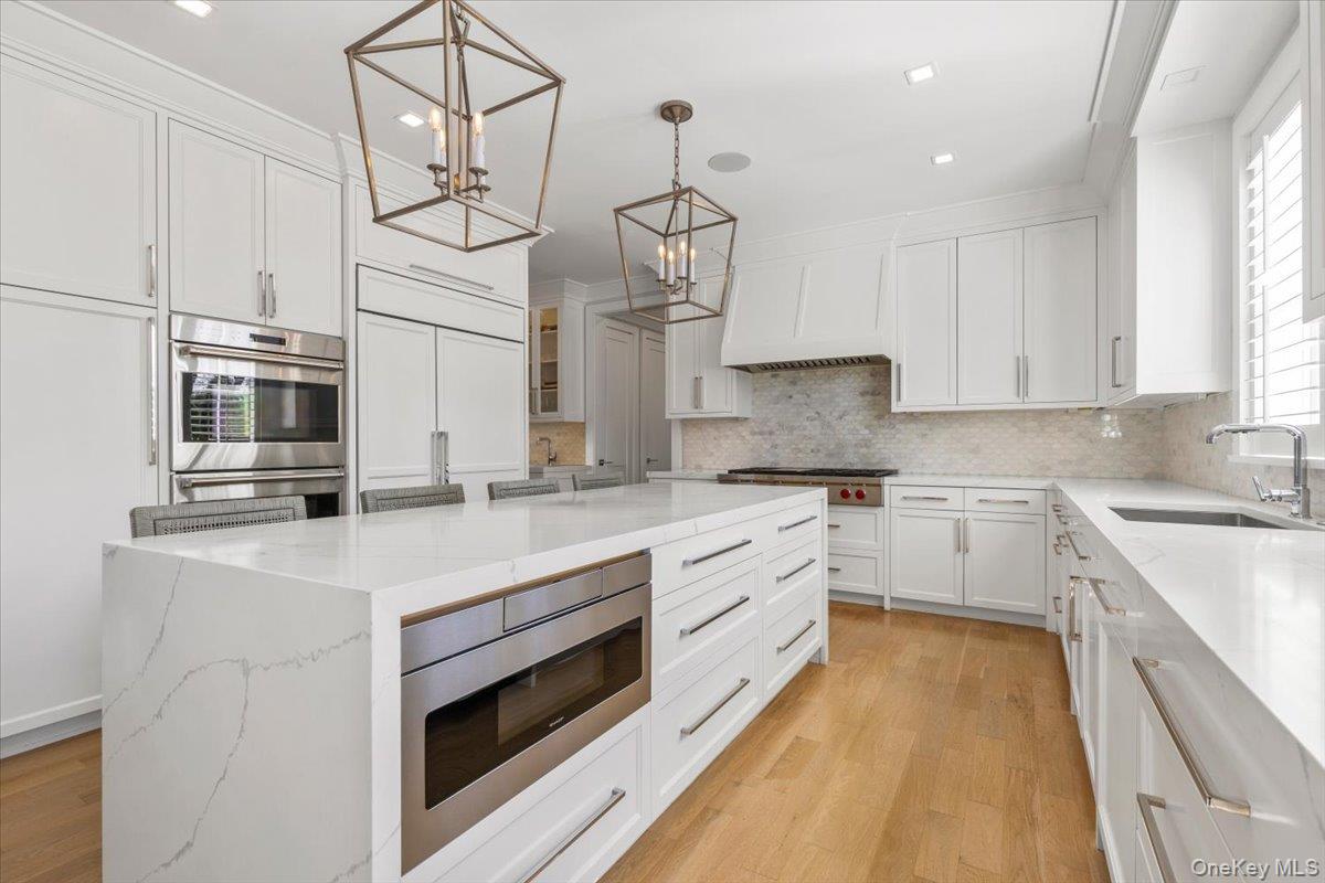 100 Dearborn Avenue Rye, NY 10580 - Photo 8 of 49 a kitchen with stainless steel appliances granite countertop a sink a stove and cabinets